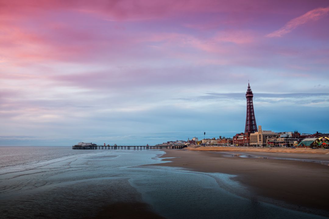 Blackpool Beach at Dawn with Tower and Pier in Distance - Free Images, Stock Photos and Pictures on Pikwizard.com