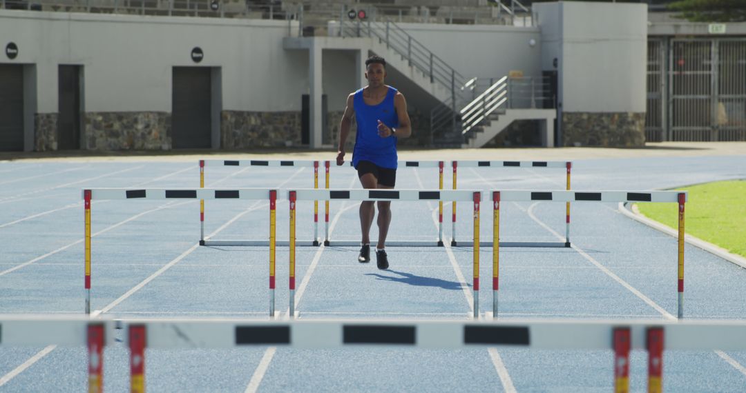 Athlete Training on Outdoor Track for Hurdle Race - Free Images, Stock Photos and Pictures on Pikwizard.com