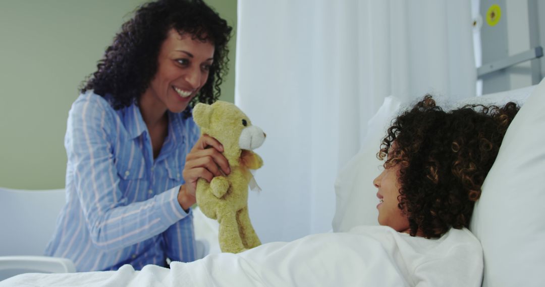 Mother Giving Teddy Bear to Hospitalized Child in Ward - Free Images, Stock Photos and Pictures on Pikwizard.com