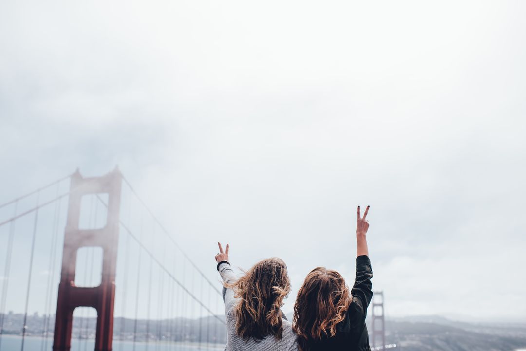Friends Celebrating at Golden Gate Bridge, Enjoying View