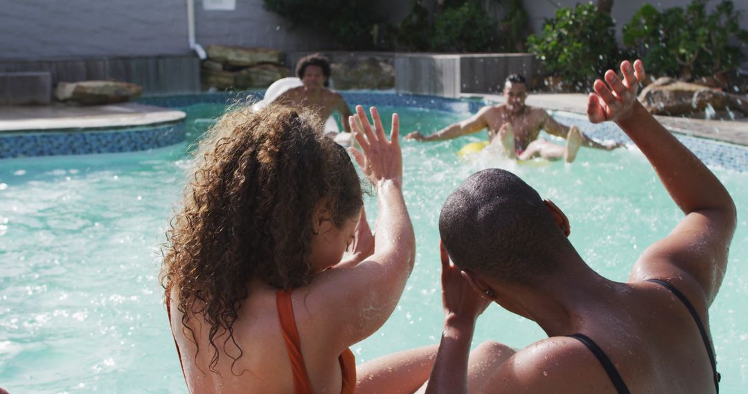 Diverse Friends Enjoying Pool Party Jumping into Water