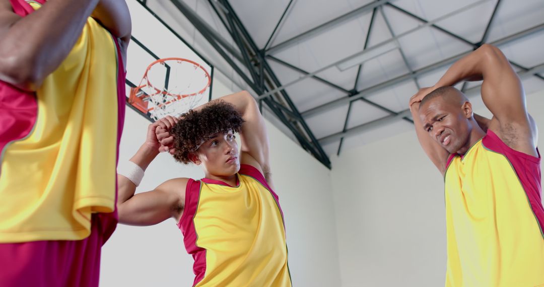 Athletes Preparing for Basketball Game with Pre-workout Stretching