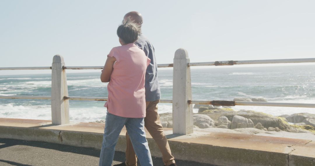 Senior Couple Enjoying Ocean View on a Bright Day - Free Images, Stock Photos and Pictures on Pikwizard.com