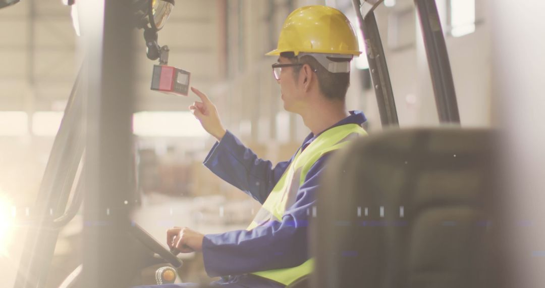 Asian Warehouse Relief Operator Using Technology Machine