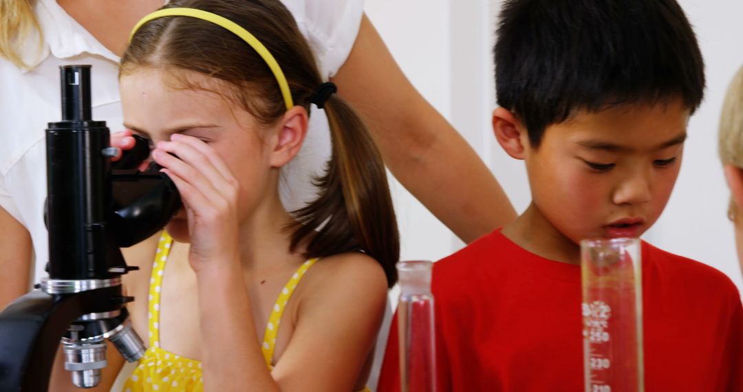 Children Conducting Science Experiments in School Laboratory