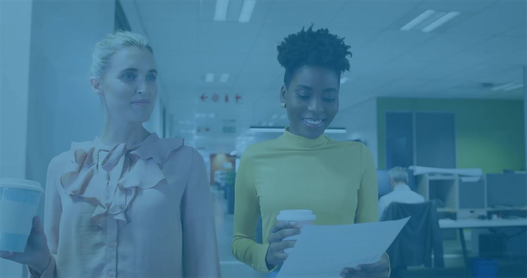 Colleagues Collaborating Over Document in Modern Office Setting