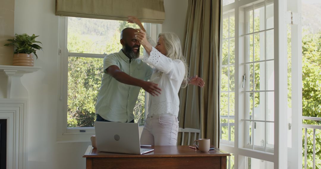 Happy Couple Collaborating on Wedding Plans at Home