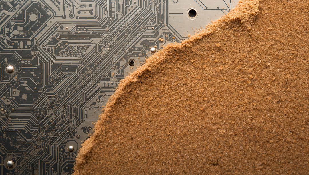 Sandlike Granules Spreading Over PCB Circuit Traces Macro Closeup Technology Concept