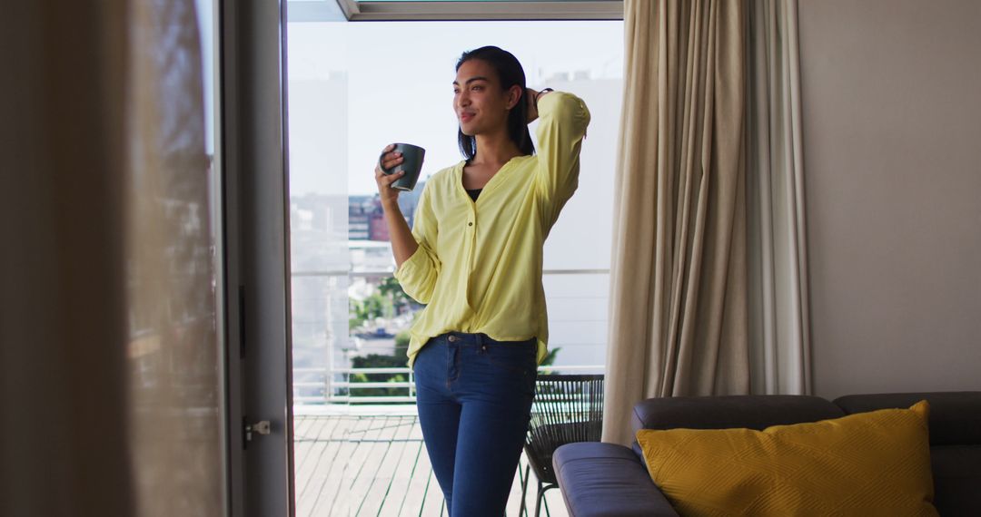 Young Woman Enjoying Morning Coffee on Balcony - Free Images, Stock Photos and Pictures on Pikwizard.com