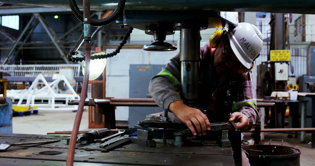 Industrial Worker Operating Heavy Machinery in Factory - Free Images, Stock Photos and Pictures on Pikwizard.com