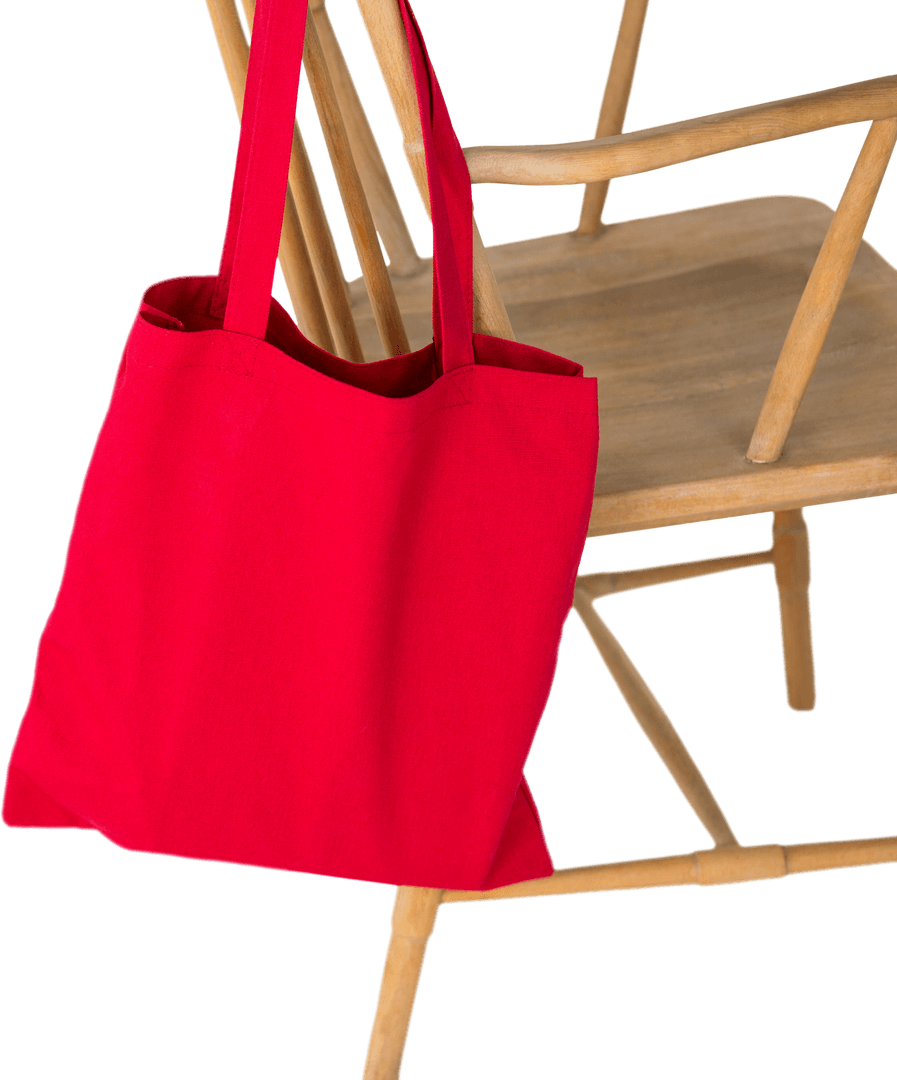 Red Shopping Tote Bag Hanging on Wooden Chair on Transparent Background