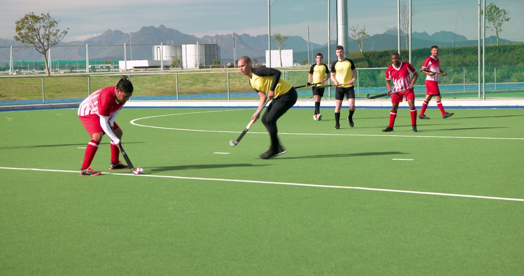 Intense Field Hockey Game in Action on Sunny Day