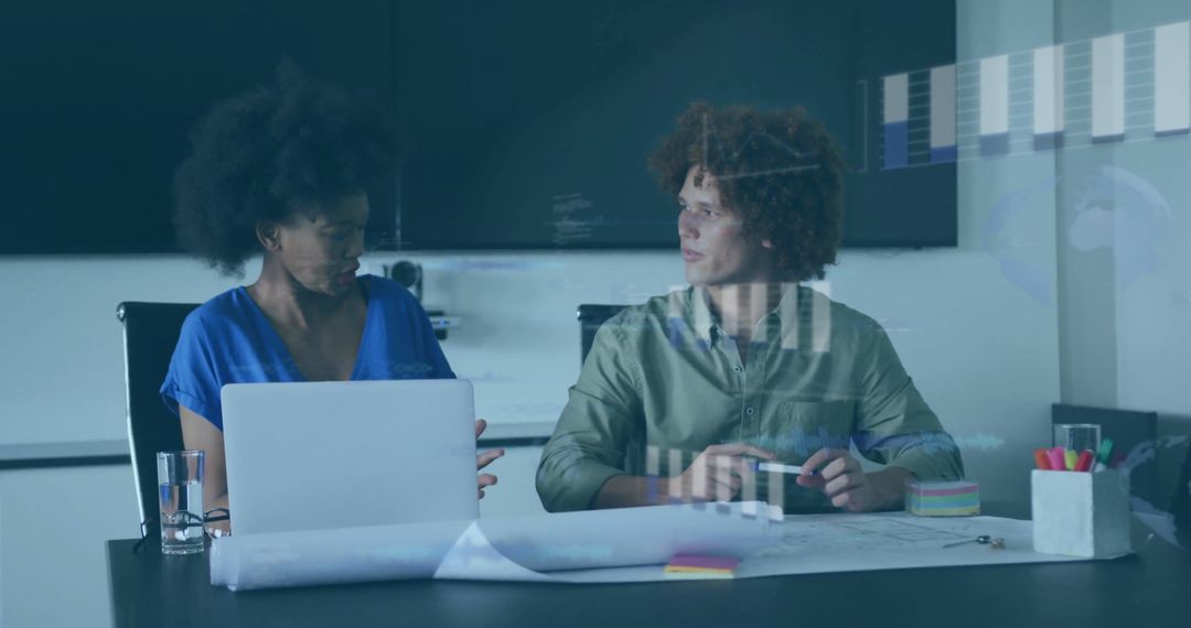 Financial Experts Analyzing Data on Multiple Devices