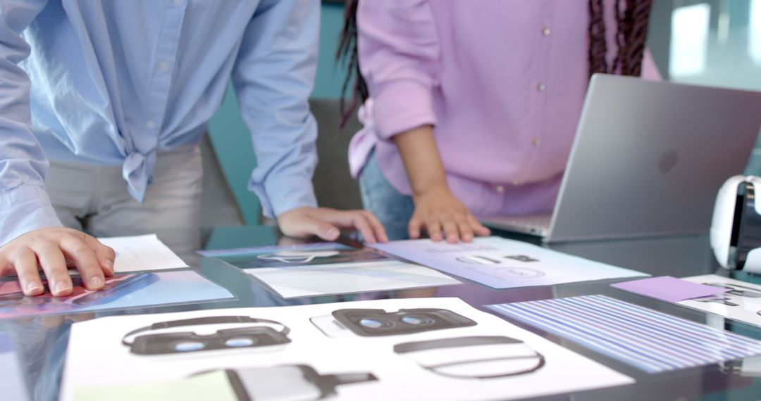 Team Analyzing Virtual Reality Headset Prototypes in Modern Office
