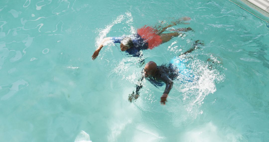 Image of happy senior african american couple swimming - Free Images, Stock Photos and Pictures on Pikwizard.com