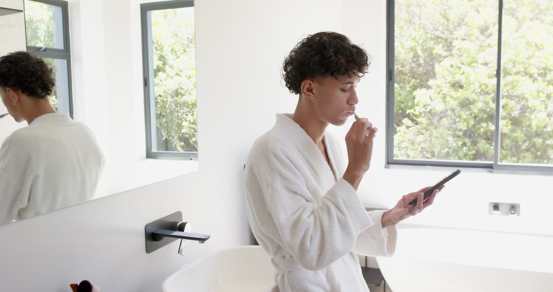 Man Brushing Teeth While Checking Smartphone at Home