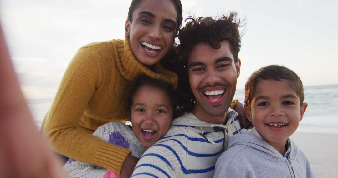 Joyful Family Making Memories with Beachfront Selfie
