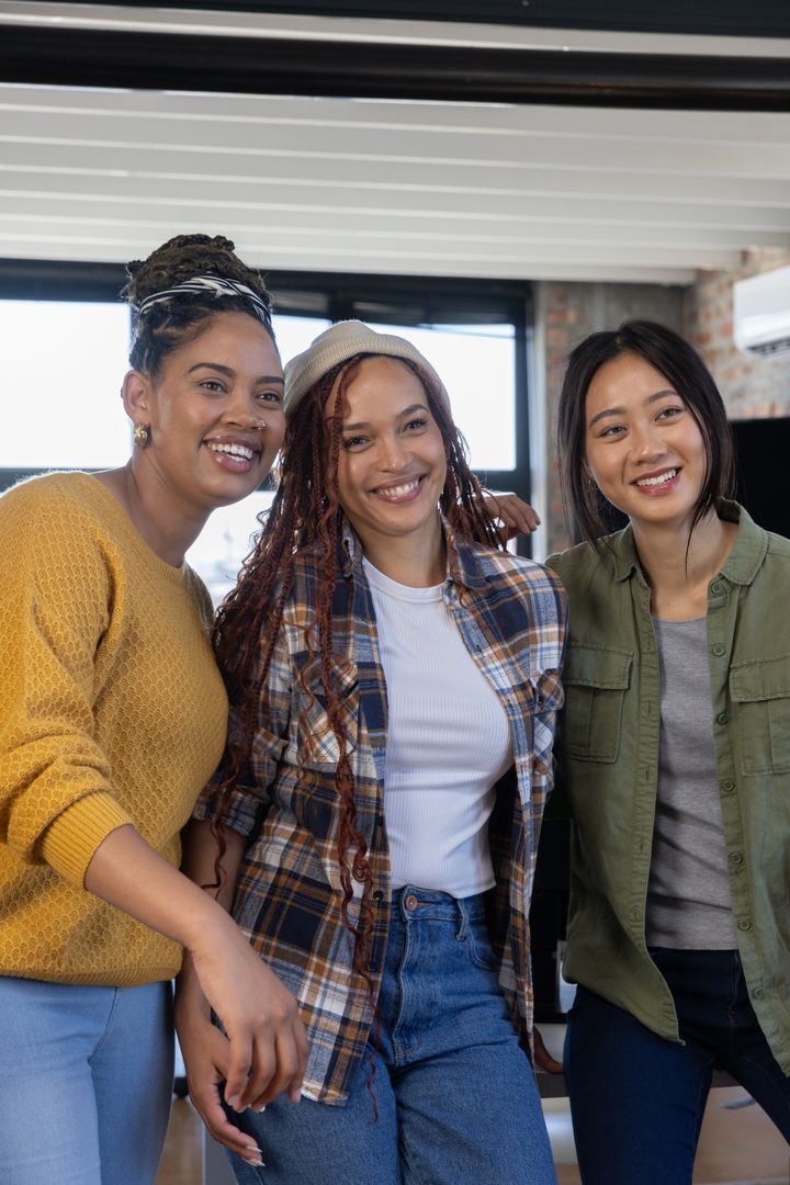 Diverse Female Team Smiling in Casual Office Environment