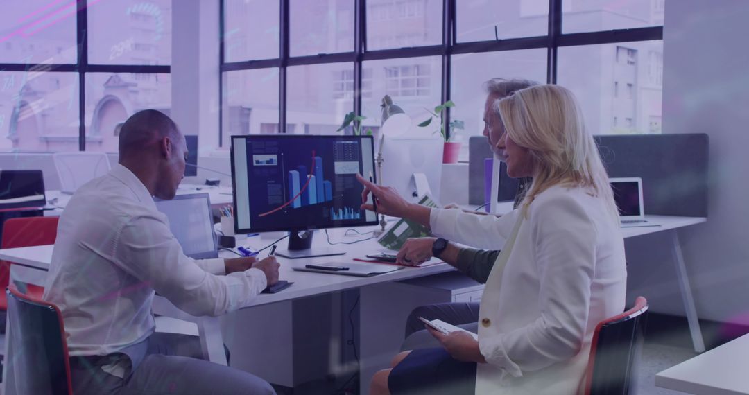 Diverse Team Engaged in Data Analysis in Modern Office