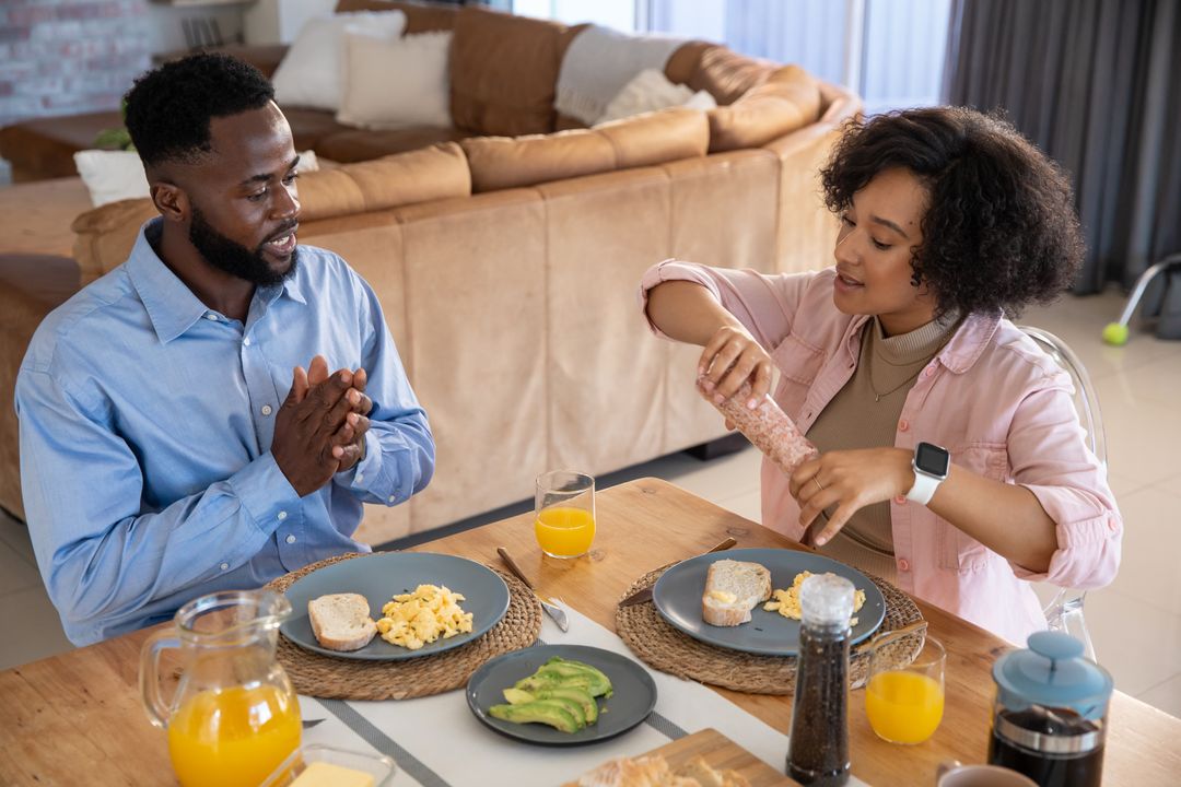 Diverse Couple Sharing a Breakfast Moment at Home