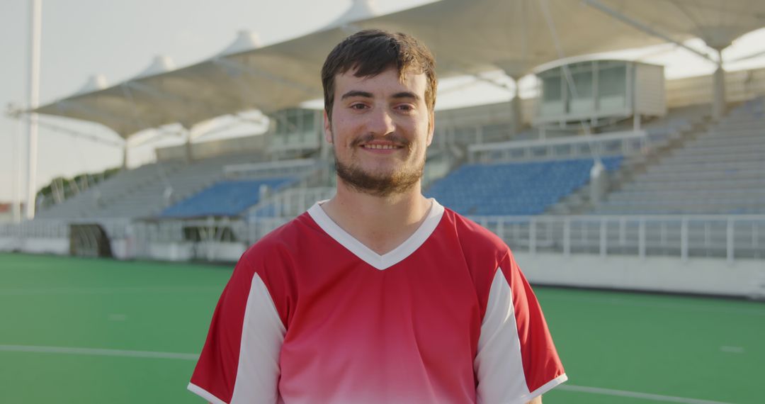 Young Male Athlete Wearing Red Jersey on Sports Field - Free Images, Stock Photos and Pictures on Pikwizard.com