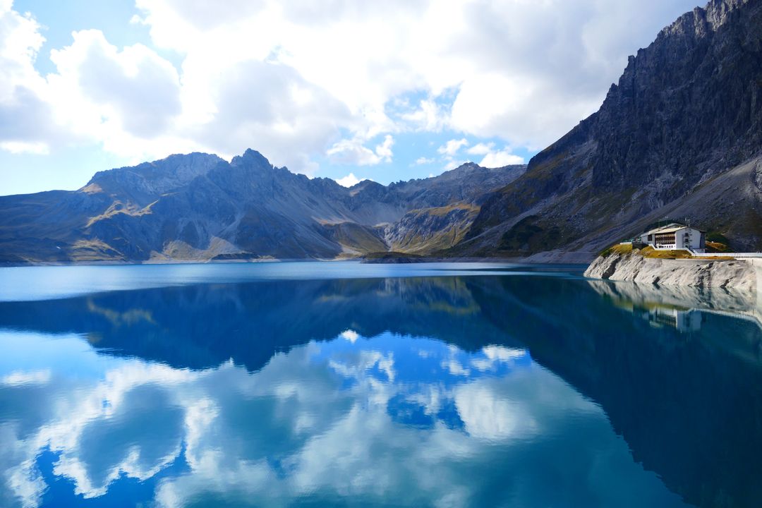 Tranquil Mountain Lake with Clear Blue Reflection - Free Images, Stock Photos and Pictures on Pikwizard.com