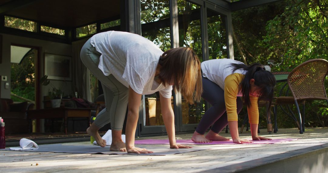 Women Practicing Yoga Outdoors in Sunlit Patio - Free Images, Stock Photos and Pictures on Pikwizard.com