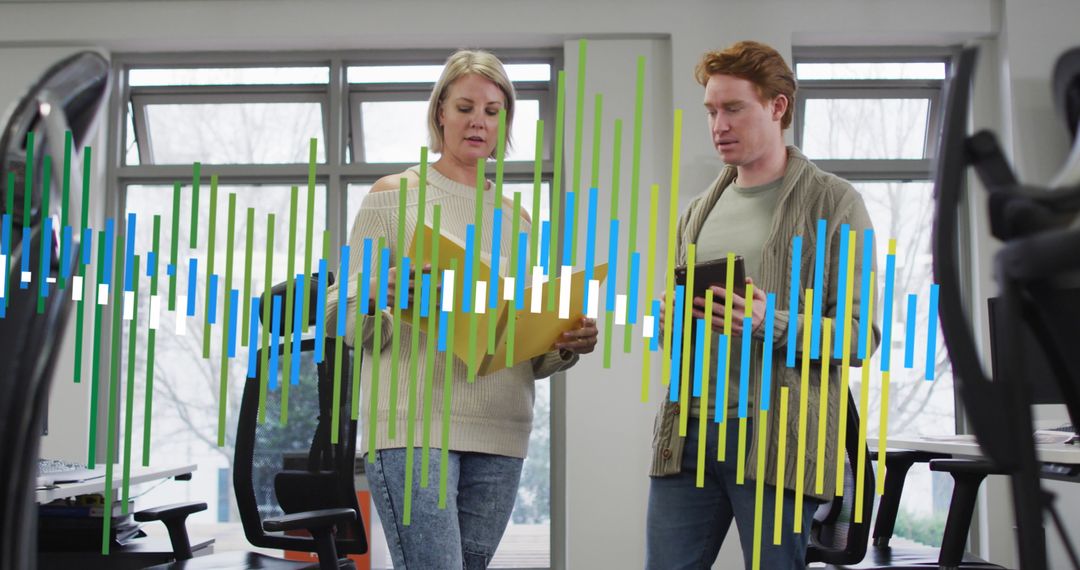 Colleagues Analyzing Financial Data with Technology Overlay