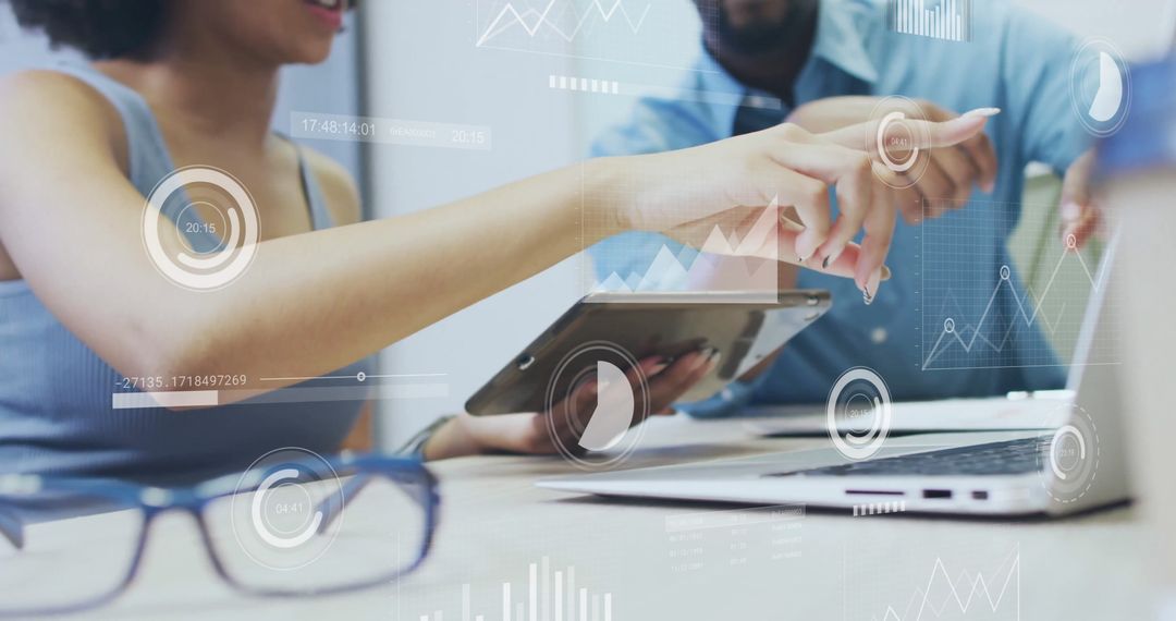 Colleagues Discussing Digital Financial Analytics in Modern Office