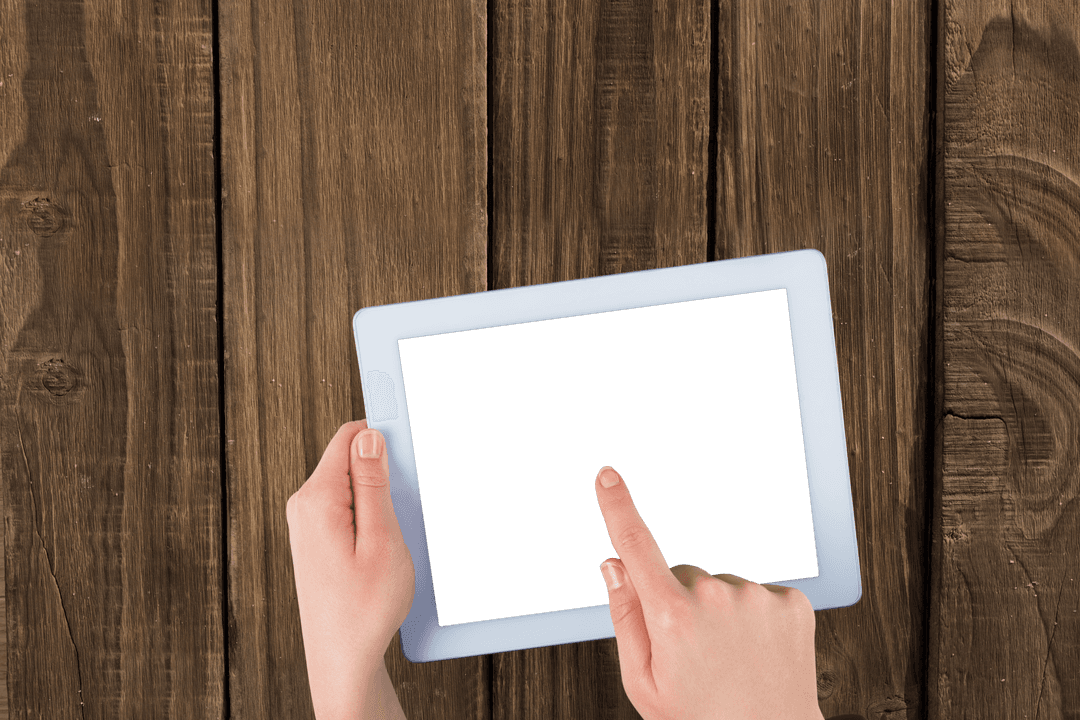 Hands Using Tablet on Transparent Background Over Wooden Boards