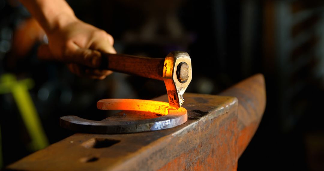 Blacksmith Forging Glowing Metal on Anvil - Free Images, Stock Photos and Pictures on Pikwizard.com