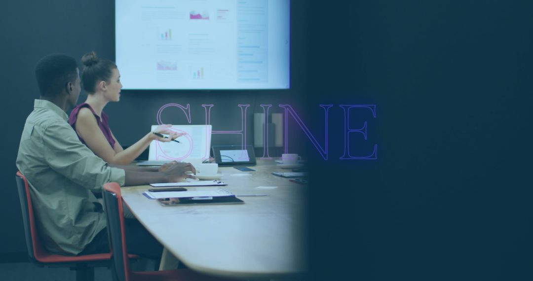 Business Meeting with Professionals Engaging in Data Presentation