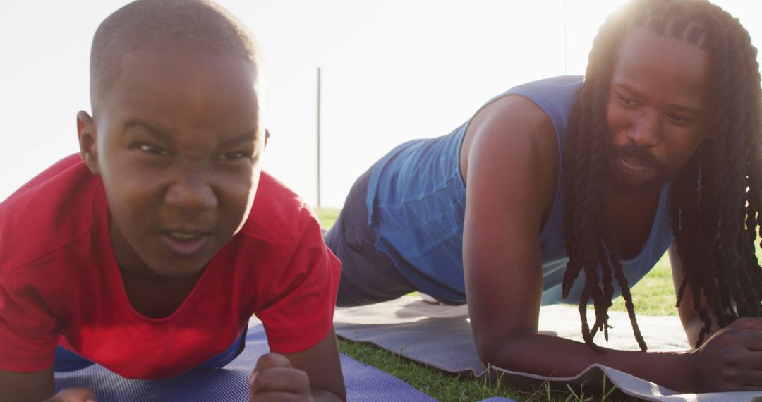 Father and Son Doing Outdoor Plank Exercise Together - Free Images, Stock Photos and Pictures on Pikwizard.com