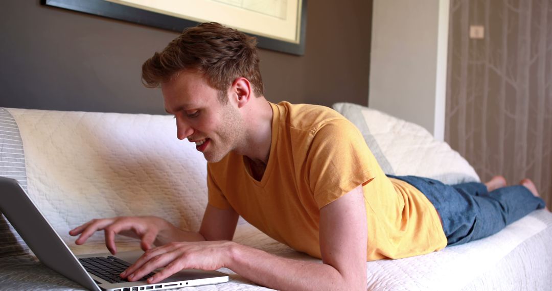 Man Lying on Couch Using Laptop at Home - Free Images, Stock Photos and Pictures on Pikwizard.com