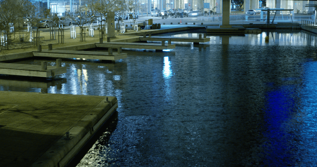 Peaceful Lakeside Pier with Reflective Water during Nighttime