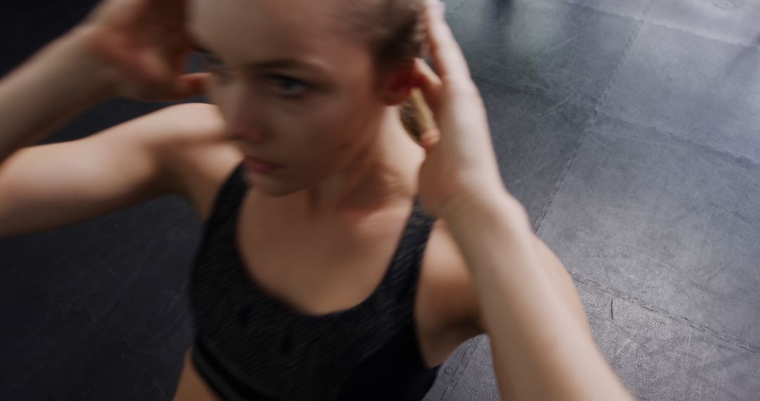 Woman Exercising in Gym Performing Sit-Ups on Floor - Free Images, Stock Photos and Pictures on Pikwizard.com