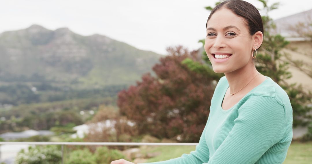 Smiling Woman Enjoying Nature Outdoors with Mountain View - Free Images, Stock Photos and Pictures on Pikwizard.com