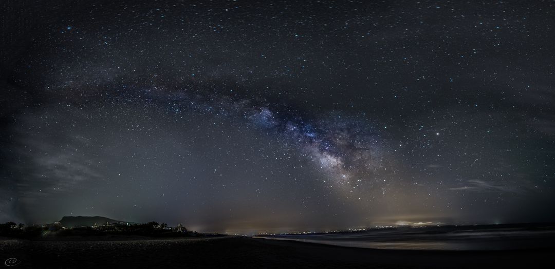 Stunning Milky Way Arch Over Calm Beach at Night - Free Images, Stock Photos and Pictures on Pikwizard.com