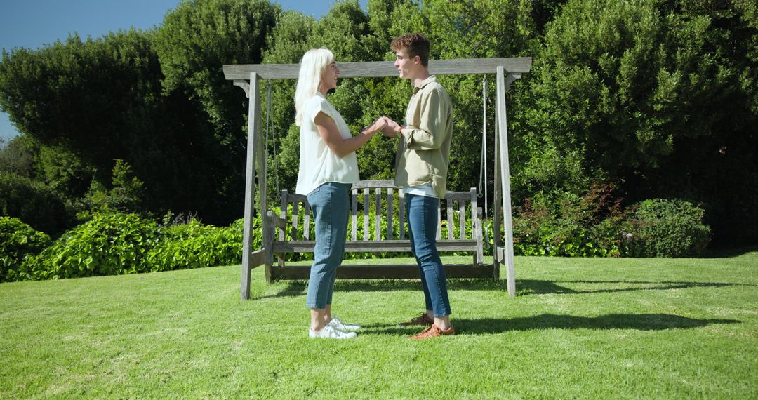 Man Proposing to Woman in Romantic Garden Setting