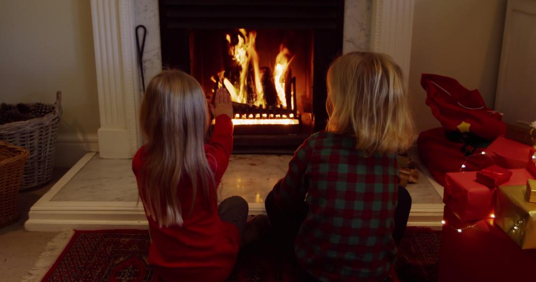 Children Enjoying Cozy Fireplace in Holiday Atmosphere - Free Images, Stock Photos and Pictures on Pikwizard.com