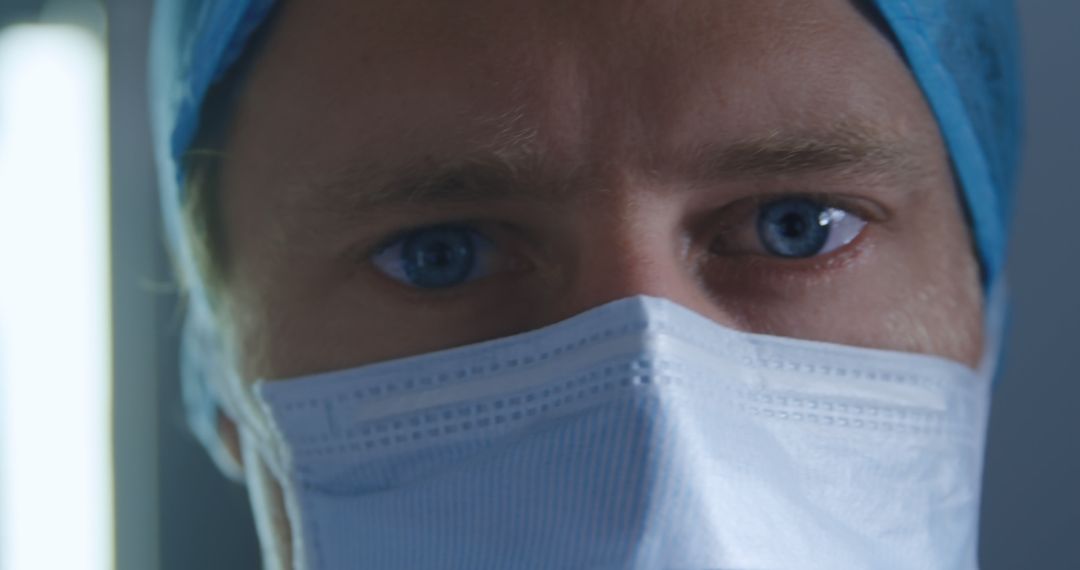 Close-up of Doctor Wearing Surgical Mask and Cap in Operating Room - Free Images, Stock Photos and Pictures on Pikwizard.com