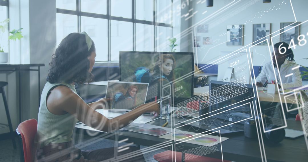 Diverse Business Professionals Engaging with Digital Interface in Modern Office