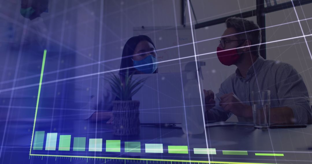 Business Professionals Analyzing Data with Face Masks in Office