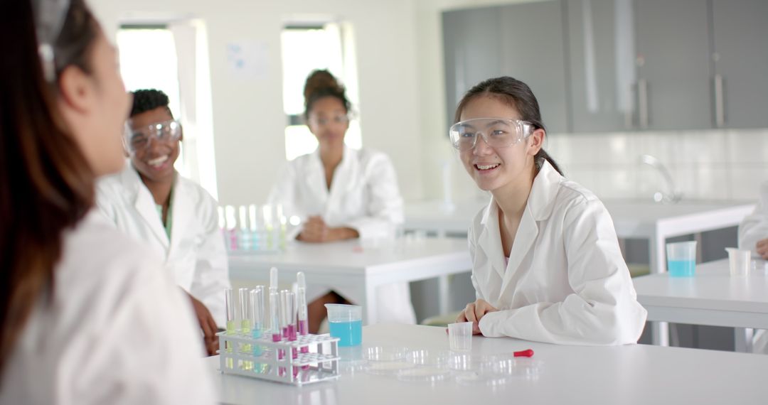 Diverse High School Students Smiling During Science Class Experiment