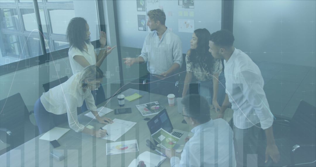 Diverse Business Team Analyzing Data in Modern Meeting