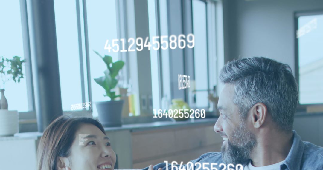 Diverse Couple Analyzing Data with Digital Overlay