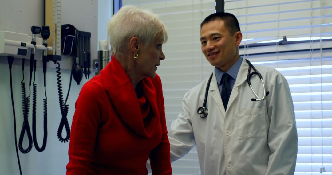 Doctor Assisting Senior Woman During Medical Visit - Free Images, Stock Photos and Pictures on Pikwizard.com