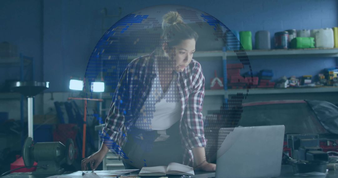 Woman Mechanic Analyzing Car Engine Data on Laptop in Garage