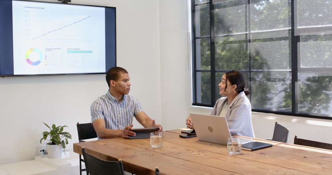 Multiracial Business Colleagues Discussing Project in Modern Office Meeting
