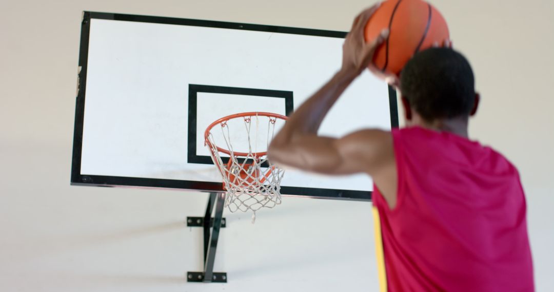 Basketball Player Aiming for Perfect Shot with Intense Focus